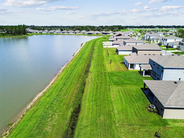 bird's eye view featuring a water view and a residential view