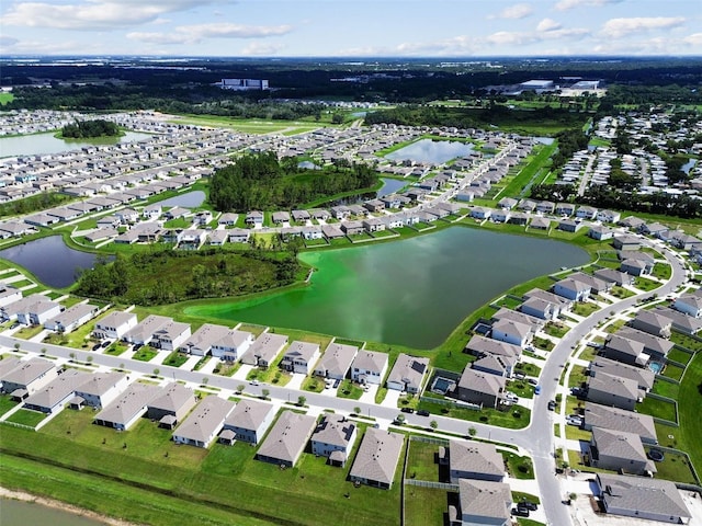 bird's eye view featuring a water view and a residential view