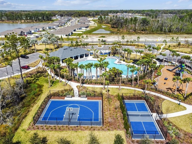 birds eye view of property with a water view and a residential view