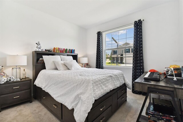 bedroom with light colored carpet