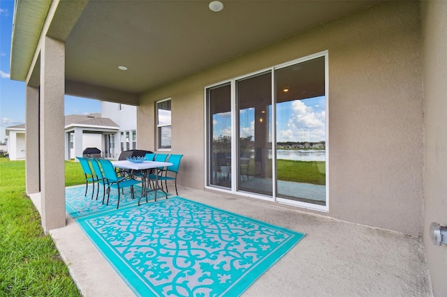 view of patio / terrace featuring a water view