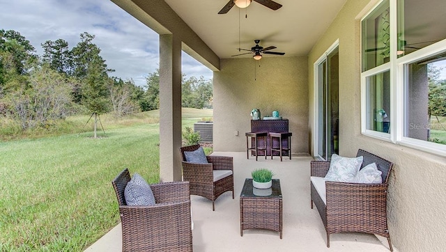 view of patio with ceiling fan and an outdoor hangout area