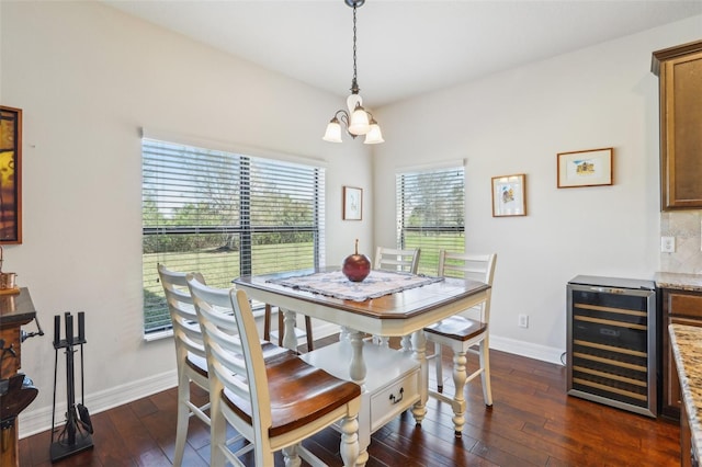 dining area with an inviting chandelier, wine cooler, baseboards, and dark wood-type flooring