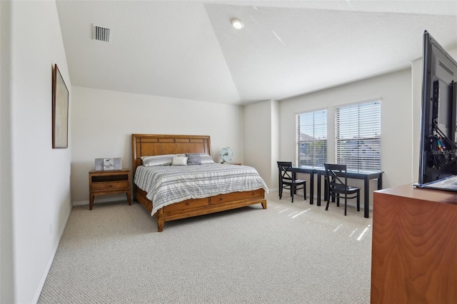 bedroom with lofted ceiling, baseboards, light carpet, and visible vents