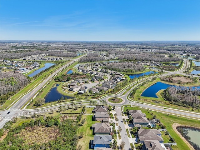 birds eye view of property featuring a water view and a residential view