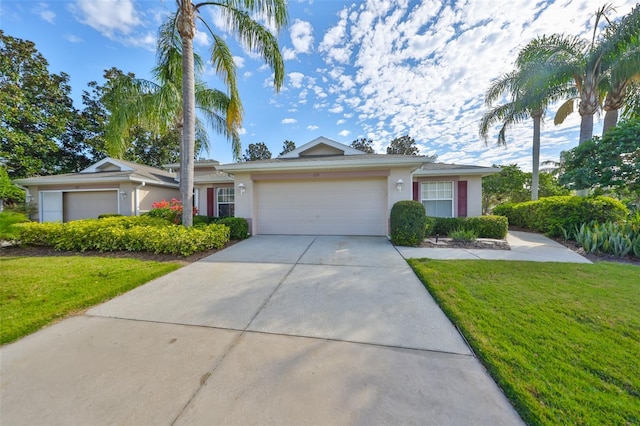 ranch-style house featuring driveway, a front yard, an attached garage, and stucco siding