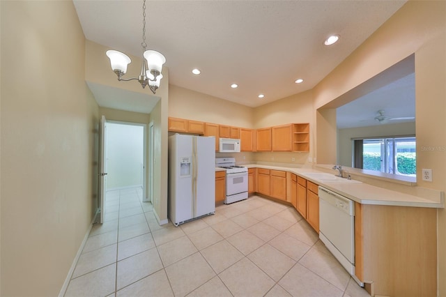 kitchen featuring white appliances, light countertops, light brown cabinetry, open shelves, and a sink