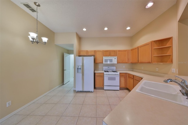 kitchen featuring white appliances, visible vents, light countertops, open shelves, and a sink