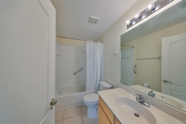 full bathroom with a textured ceiling, tile patterned flooring, toilet, vanity, and visible vents