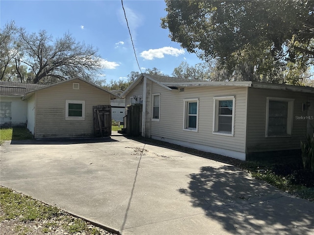 view of home's exterior featuring driveway