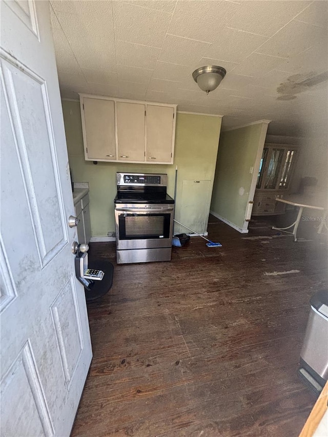 kitchen featuring dark wood-style flooring and stainless steel electric range