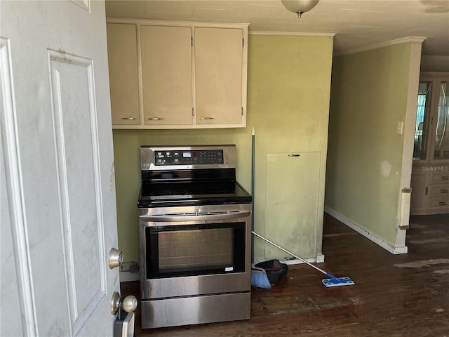 kitchen featuring stainless steel range with electric cooktop, dark wood finished floors, and baseboards