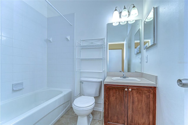 bathroom featuring toilet, bathtub / shower combination, vanity, and tile patterned floors