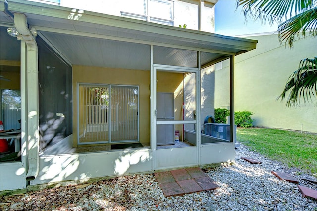 property entrance featuring stucco siding