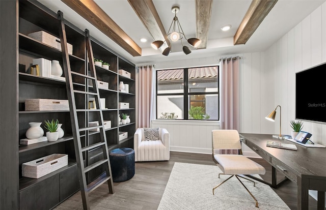 office space with an inviting chandelier, beam ceiling, and wood finished floors