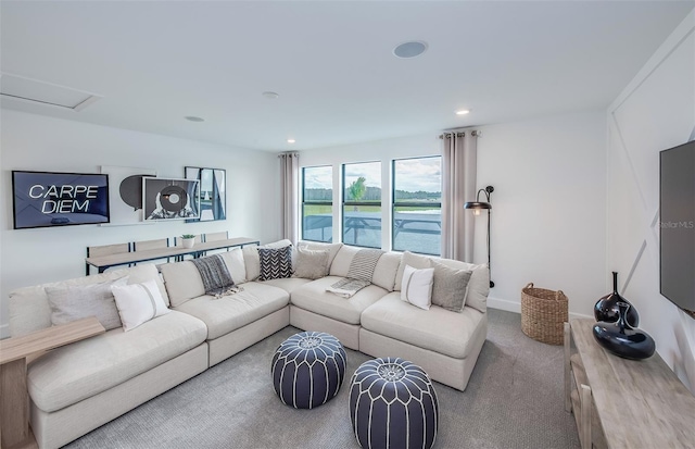 living area featuring baseboards, carpet, and recessed lighting