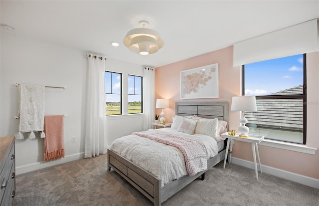 carpeted bedroom with baseboards