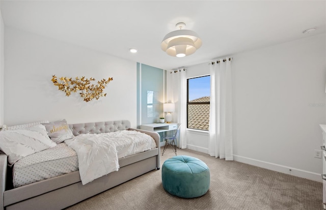 bedroom with carpet flooring and baseboards