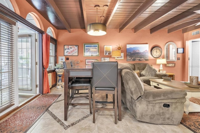 dining space with wood ceiling, beam ceiling, and light tile patterned floors