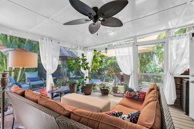 sunroom featuring a ceiling fan