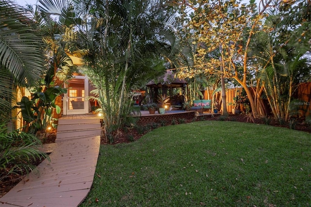 view of yard featuring a patio area, fence, and a gazebo