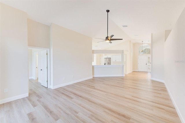 unfurnished living room with light wood-type flooring, a ceiling fan, and baseboards