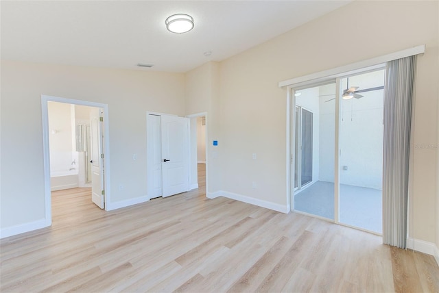 unfurnished bedroom with visible vents, light wood-style flooring, and baseboards