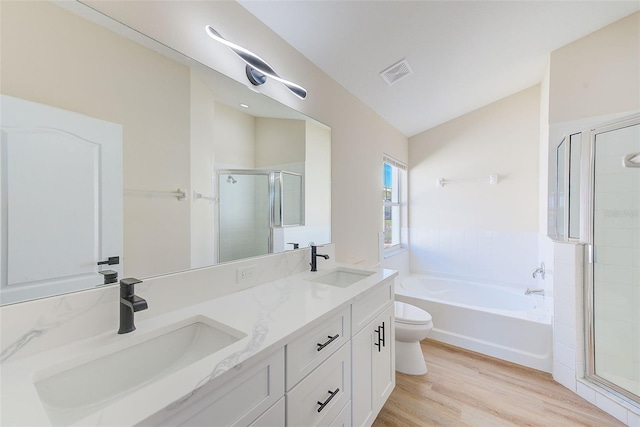 full bath with toilet, a shower stall, visible vents, and a sink