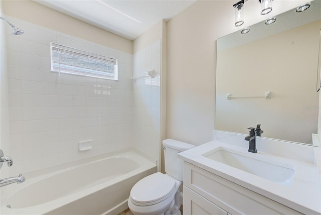 full bathroom featuring tub / shower combination, vanity, and toilet