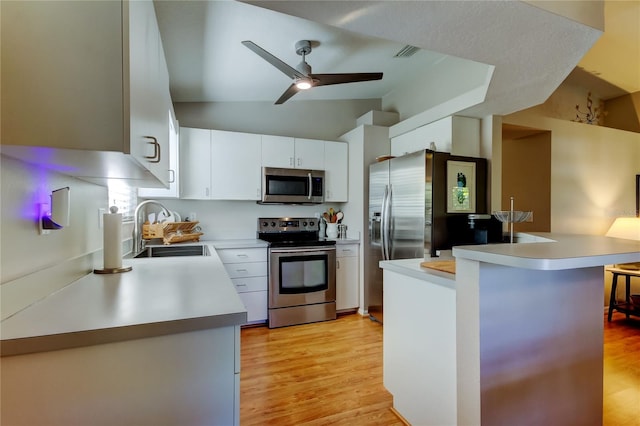 kitchen with light countertops, a ceiling fan, visible vents, appliances with stainless steel finishes, and a sink