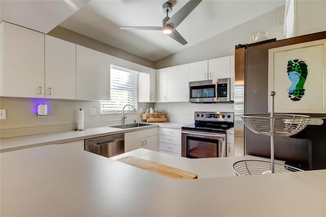 kitchen with white cabinets, ceiling fan, a sink, and appliances with stainless steel finishes