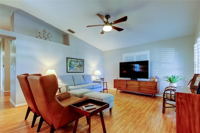 living room with light wood-style flooring, ceiling fan, baseboards, and visible vents