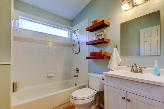bathroom featuring toilet, vanity, and bathing tub / shower combination