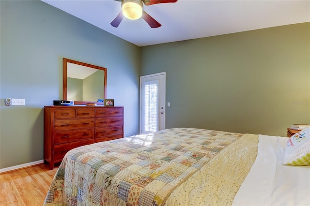 bedroom with baseboards, a ceiling fan, and light wood-style floors