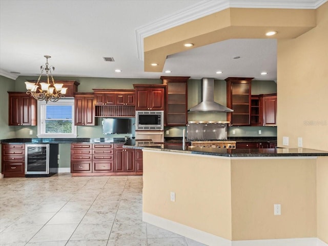 kitchen with wine cooler, ornamental molding, reddish brown cabinets, wall chimney exhaust hood, and stainless steel microwave