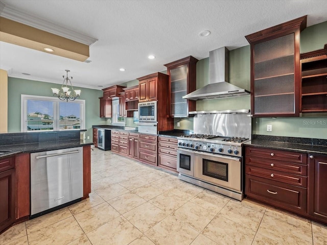 kitchen with reddish brown cabinets, ornamental molding, decorative light fixtures, stainless steel appliances, and wall chimney range hood