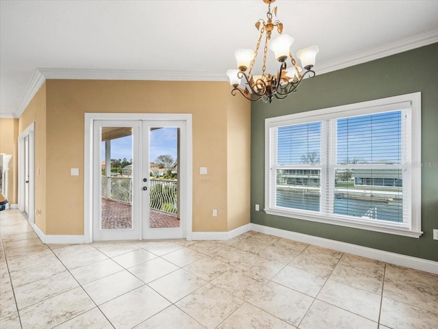 entryway featuring plenty of natural light, french doors, crown molding, and baseboards