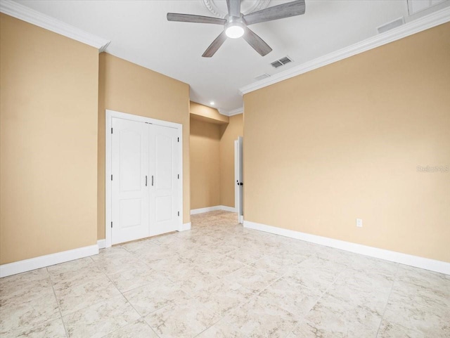 empty room featuring ornamental molding, visible vents, ceiling fan, and baseboards