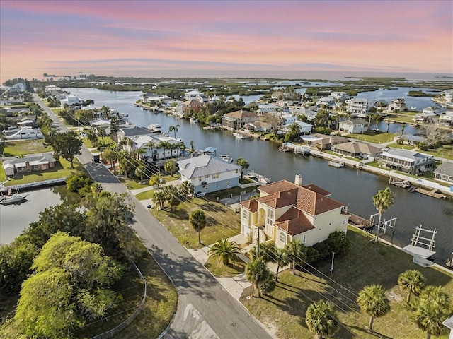 bird's eye view with a water view and a residential view