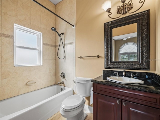 bathroom with toilet, plenty of natural light, shower / washtub combination, and vanity