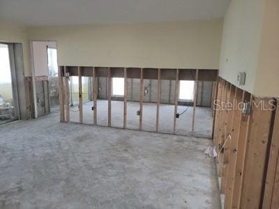 unfurnished room featuring concrete flooring