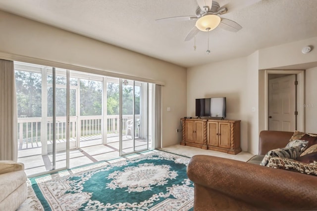 living area featuring ceiling fan