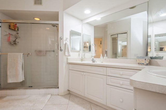 full bath with visible vents, tile patterned floors, vanity, a shower stall, and recessed lighting