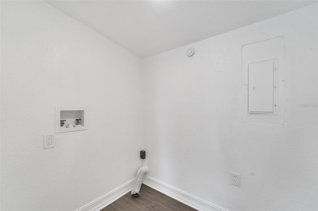 washroom with laundry area, electric panel, baseboards, dark wood-style floors, and washer hookup