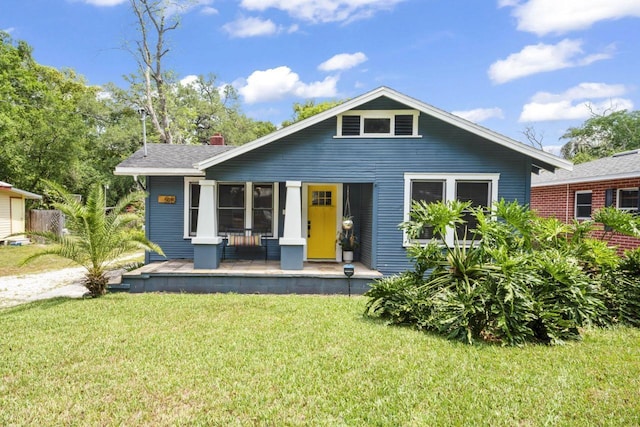 bungalow featuring a front yard