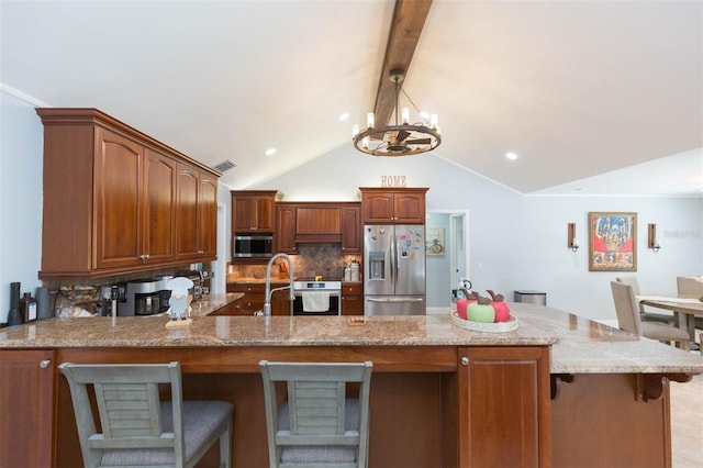 2709 Fairway View Dr, Valrico, FL 33596 - kitchen featuring visible vents, lofted ceiling with beams, decorative backsplash, appliances with stainless steel finishes, and light stone countertops