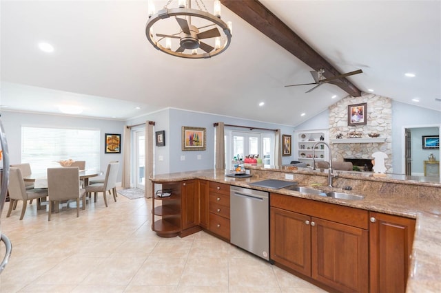 2709 Fairway View Dr, Valrico, FL 33596 - kitchen featuring brown cabinets, light stone countertops, stainless steel dishwasher, a fireplace, and a sink