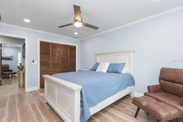 2709 Fairway View Dr, Valrico, FL 33596 - bedroom with baseboards, ornamental molding, a closet, and light wood-style floors
