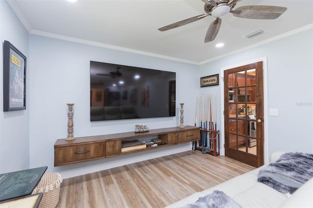 2709 Fairway View Dr, Valrico, FL 33596 - living area with ornamental molding, a ceiling fan, visible vents, and wood finished floors
