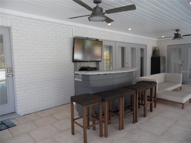2709 Fairway View Dr, Valrico, FL 33596 - view of patio with outdoor dry bar, ceiling fan, and french doors